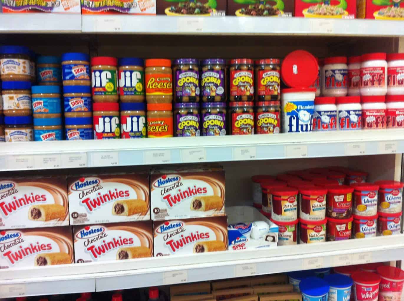 Store shelves with American food items on it such as Jif peanut butter Twinkies and Marshmallow Fluff
