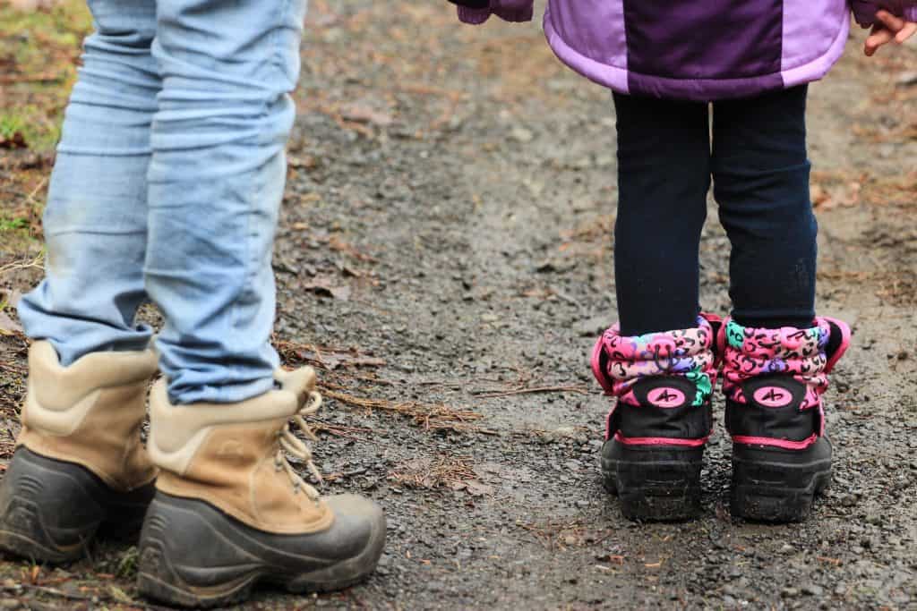 man and child wearing boots