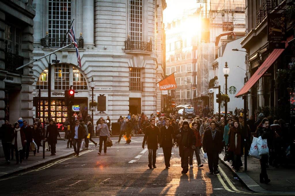 Shoppers pass high end shops on London's Bond Street. Known for