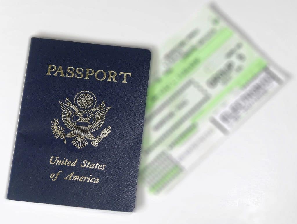 American passport and plane ticket