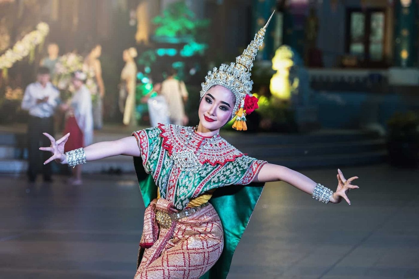 Dancer in colorful clothes and intricately designed headwear