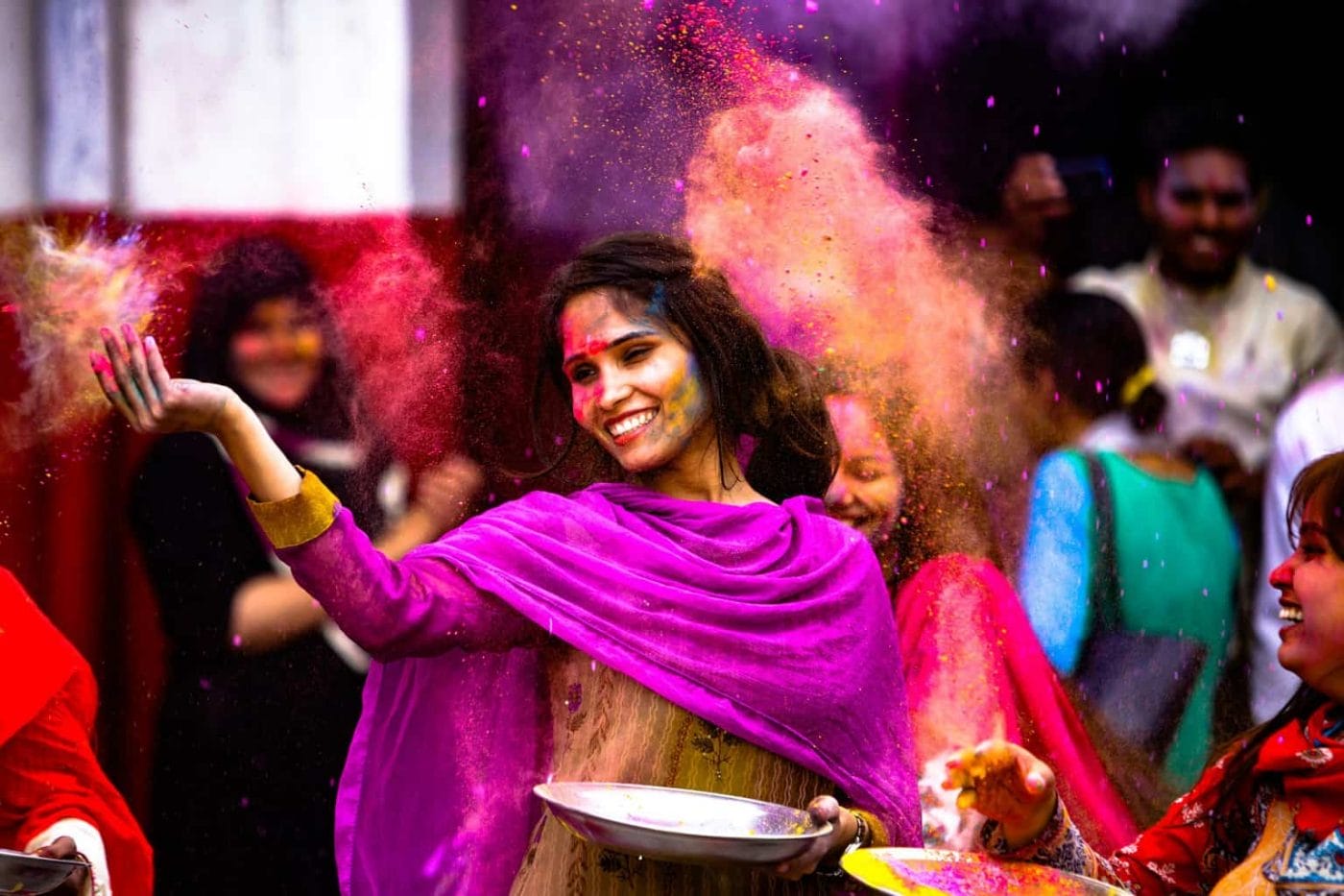 Lady in colorful clothes with spices in the air
