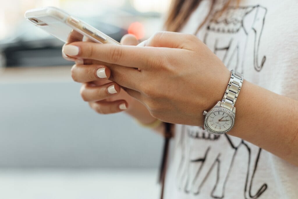 hands texting on phone