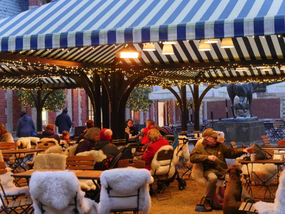 People sitting outside a cafe at Waddesdon manor