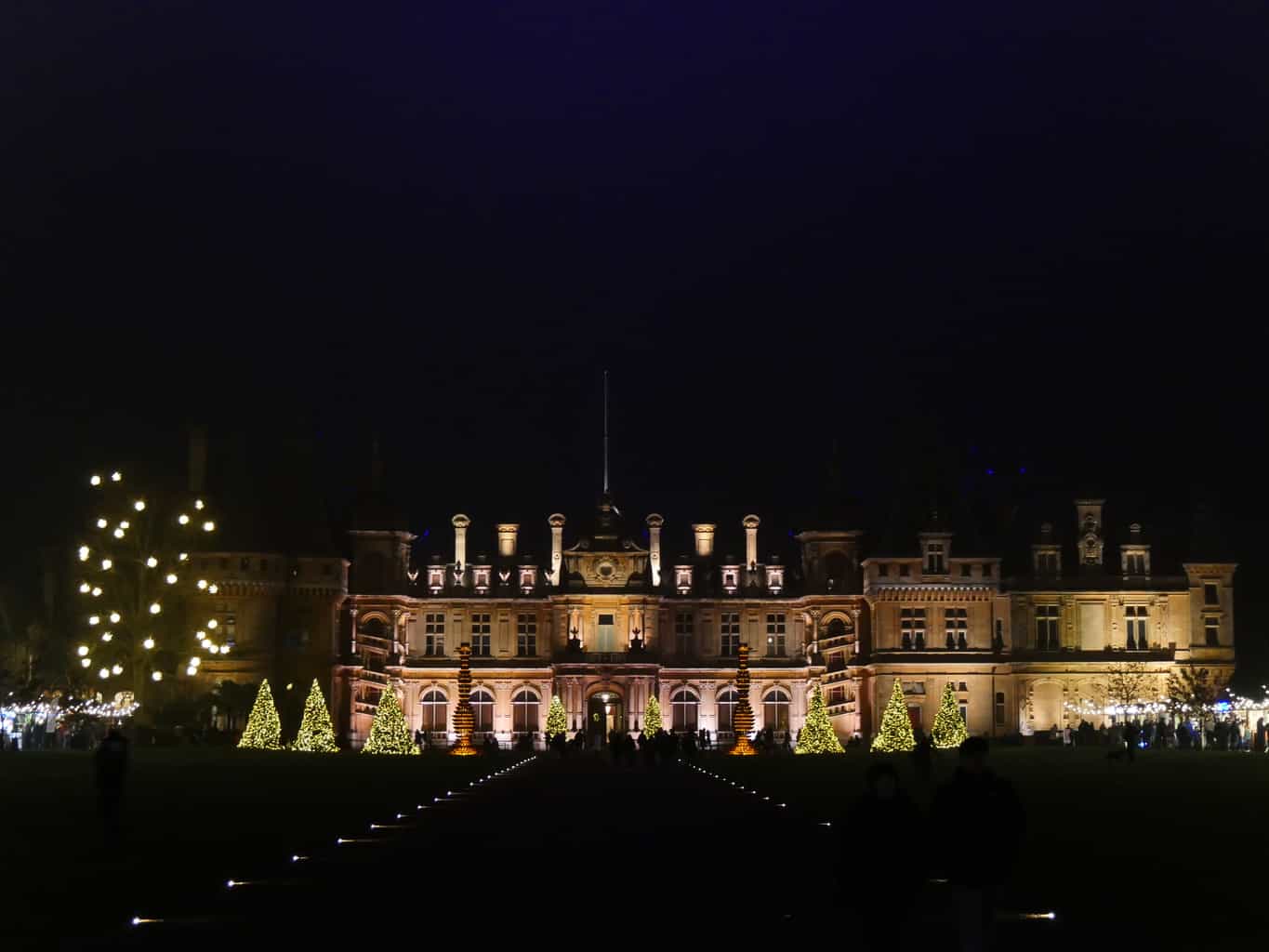 Waddesdon Manor lit up at night at Christmas