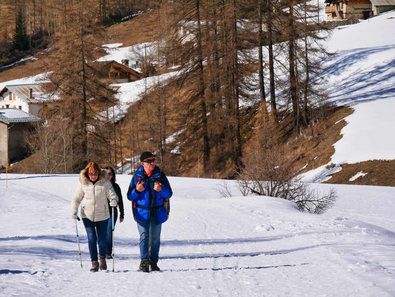 People walking in snow in valley between Les Arcs and La Plagne in the French Alps