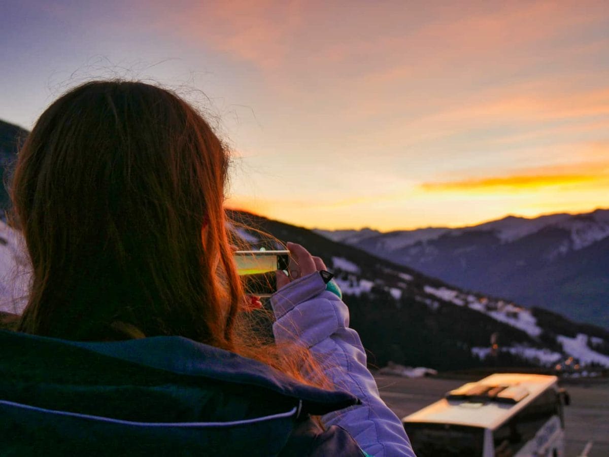 Kalyn taking a picture of the sunset over the French Alps