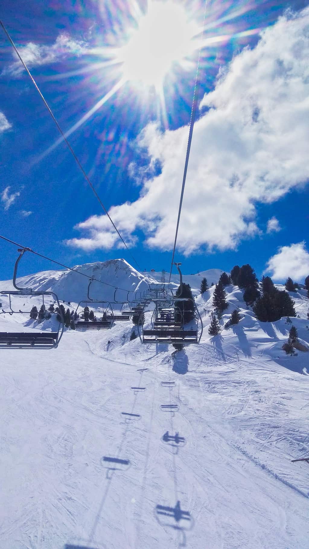 Chairlift going up ski slope Les Arcs