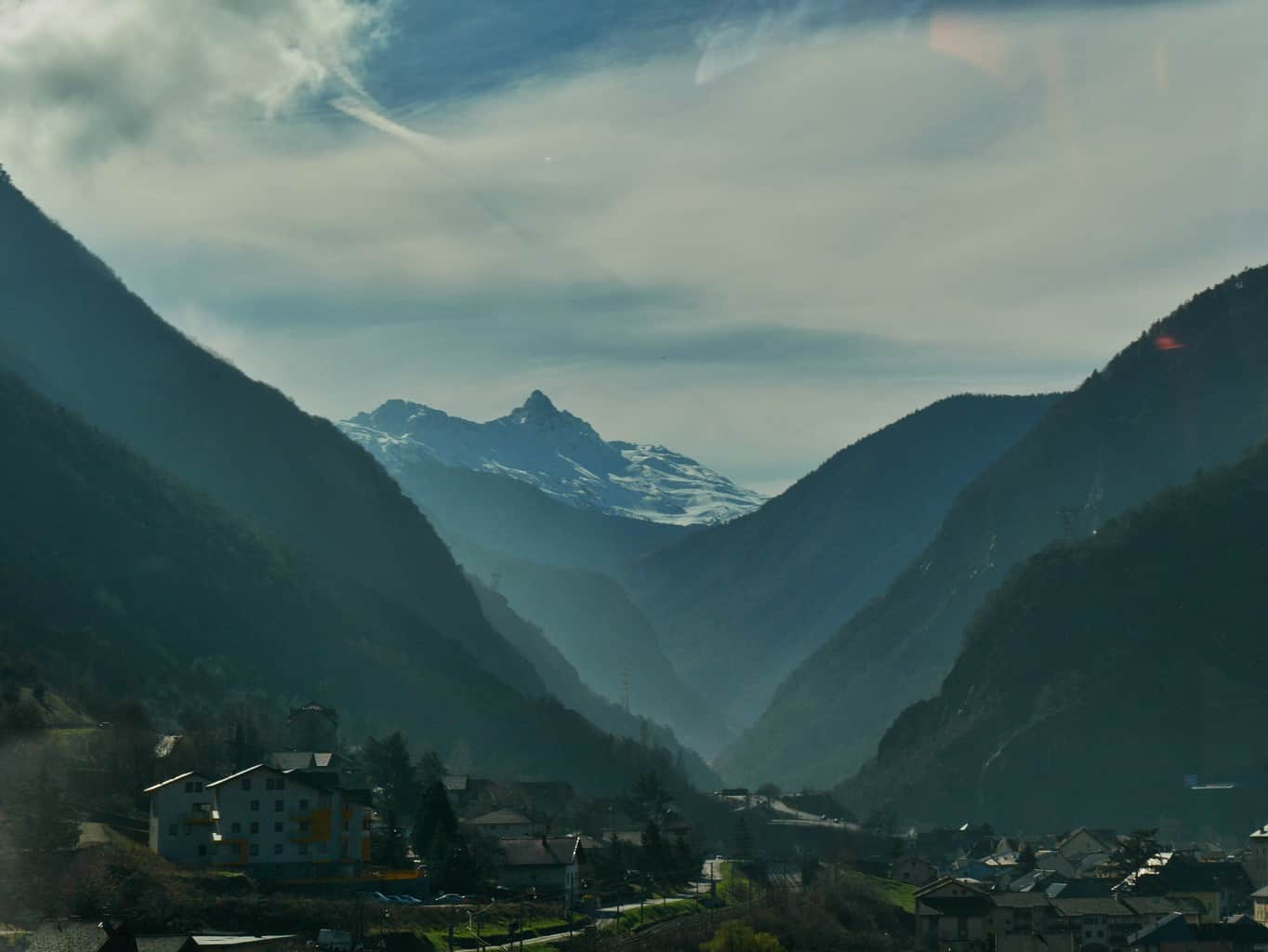 French Alps from the road with fog between the mountains