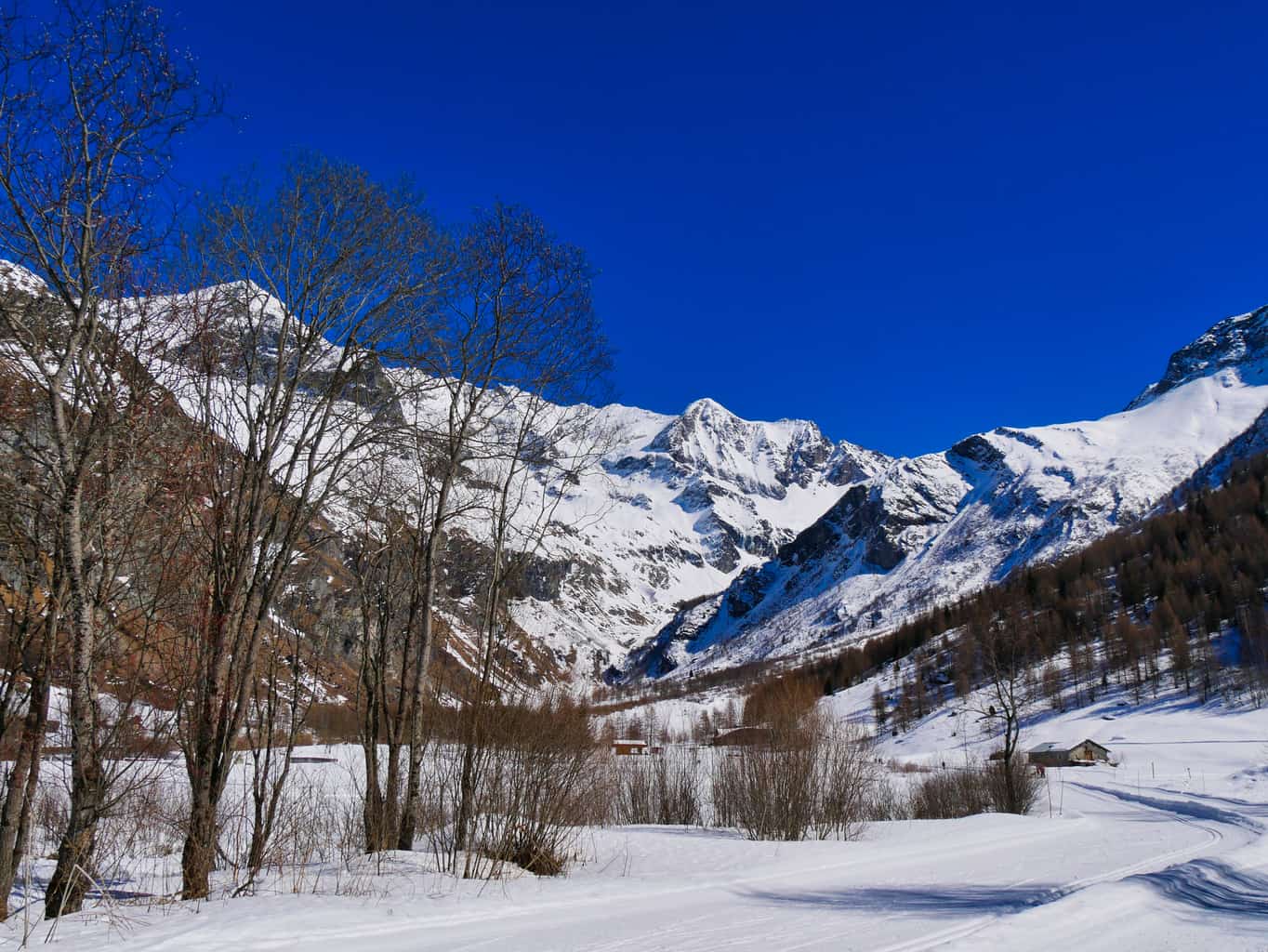 Deep blue sky over snowy mountains in valley of Les Arcs and La Plagne