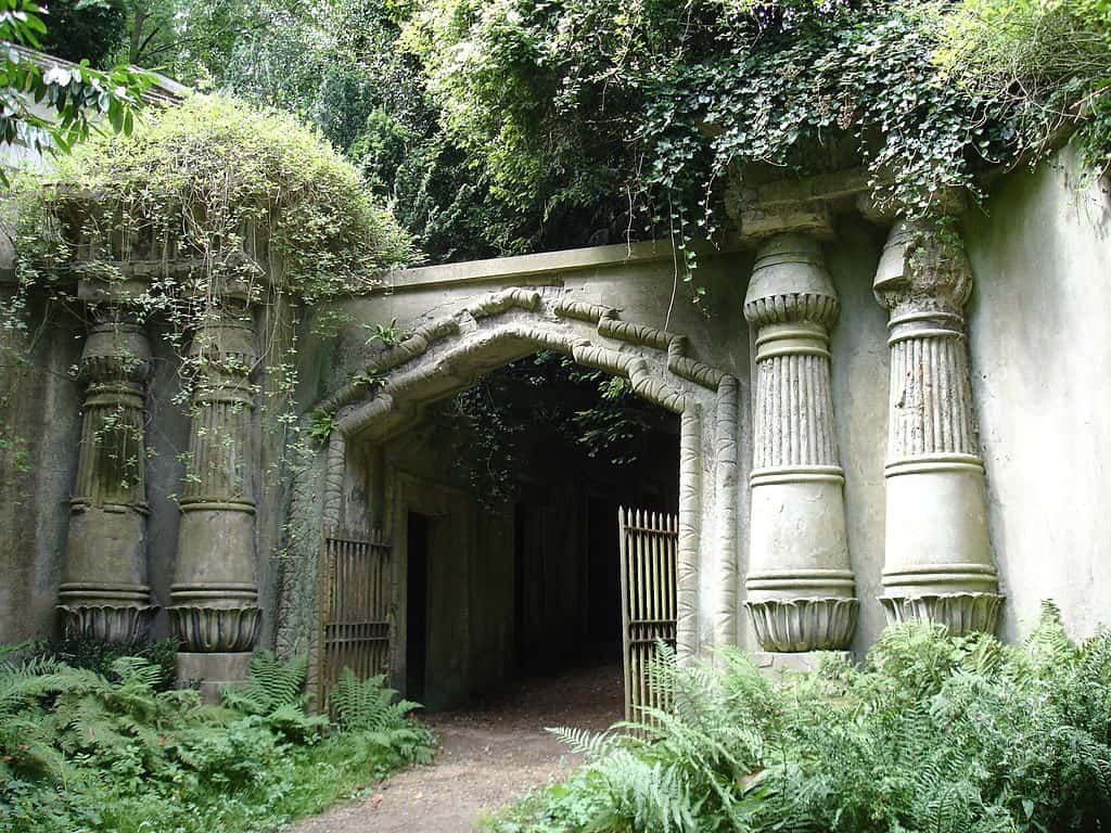 Egyptian Avenue in Highgate Cemetary in London arches covered with greenery