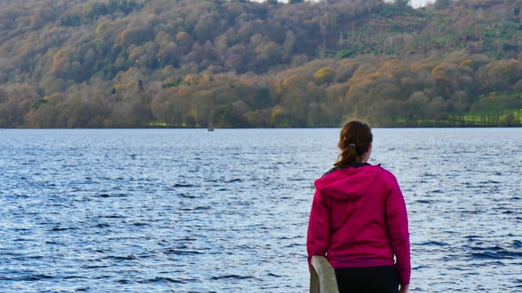 Kalyn standing in front of lake