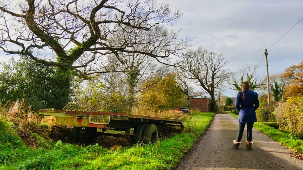 A vehicle trailer next to a path