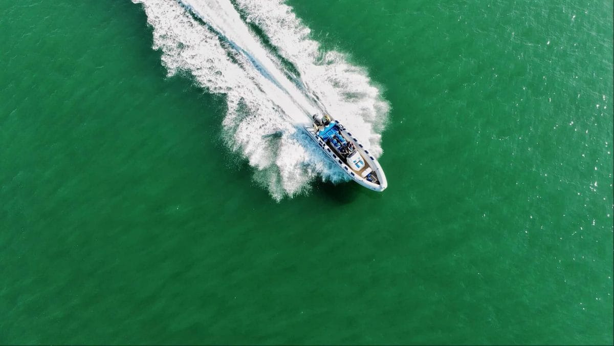 RIB boat speeding along water