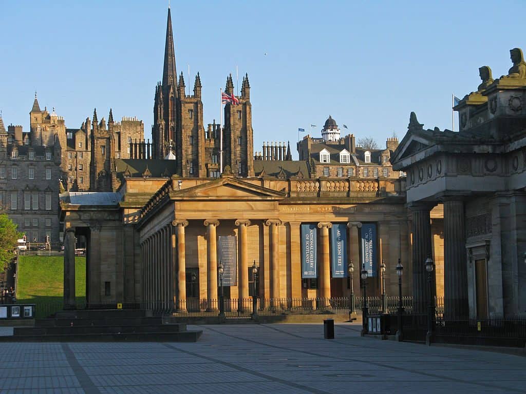 Scottish Natinal Gallery in Edinburgh. Old building with stone pillars and blue sky.