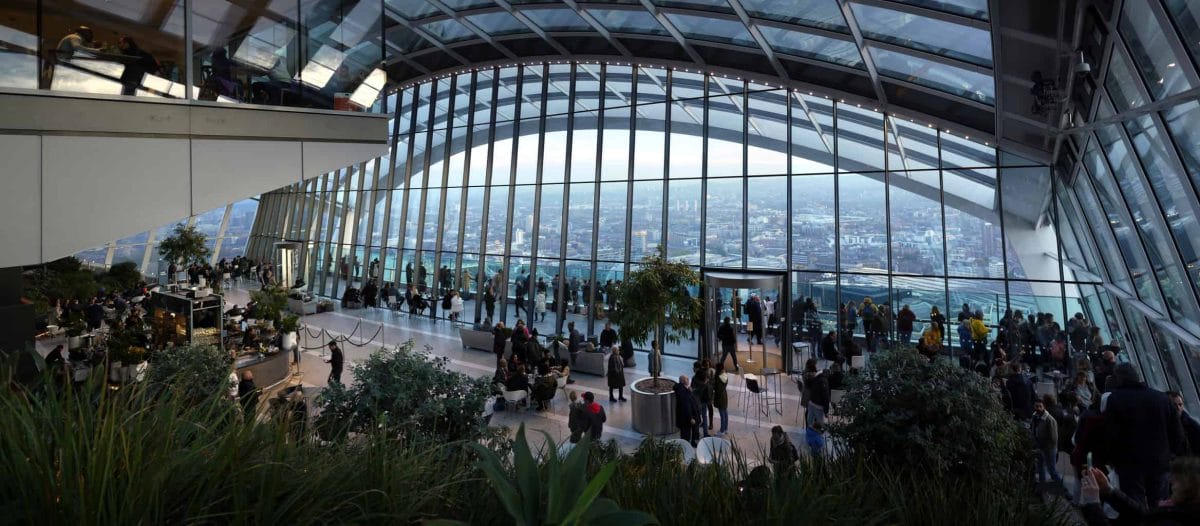 View from inside "Sky Garden" in 20 Fenchurch Street London with people milling about