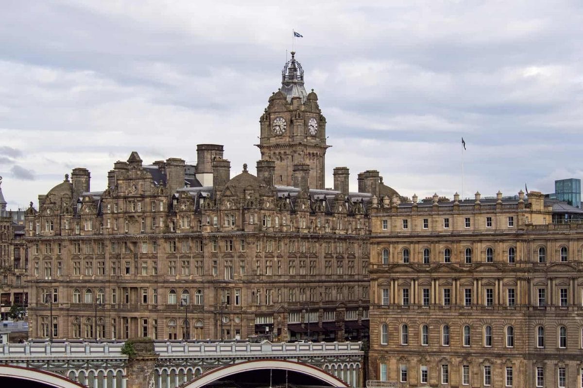 The Balmoral Hotel in Edinburgh with grey clouds behind