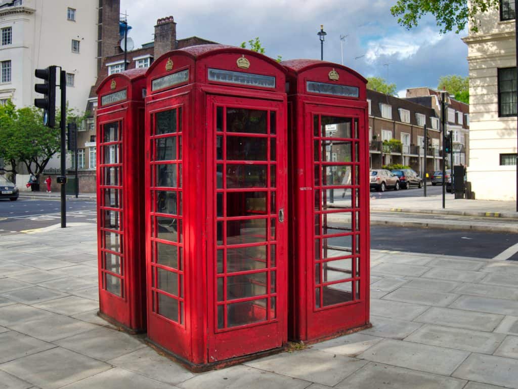 Three red telephone booths in London