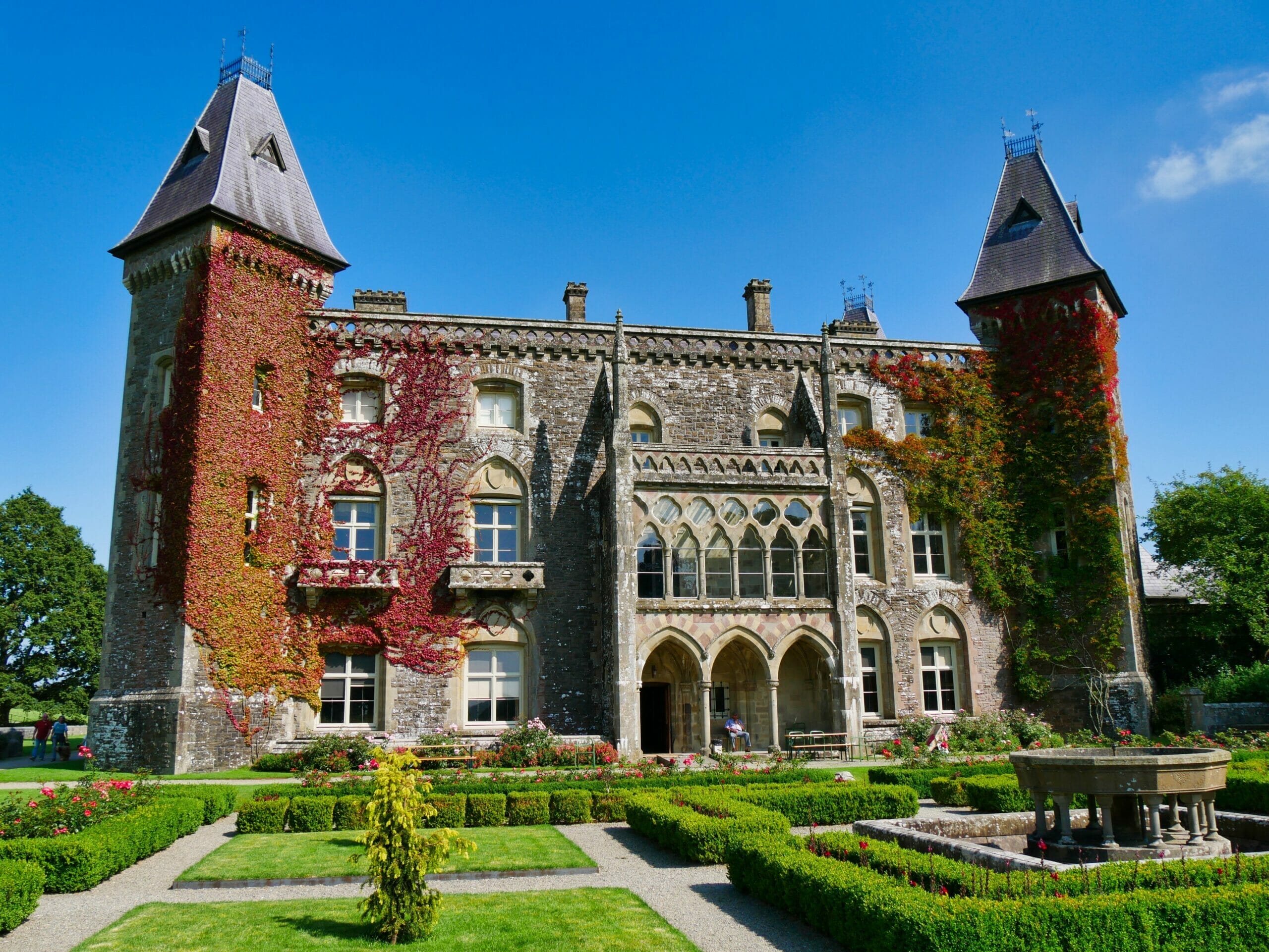 Newton House in Wales with a well-kept garden in front