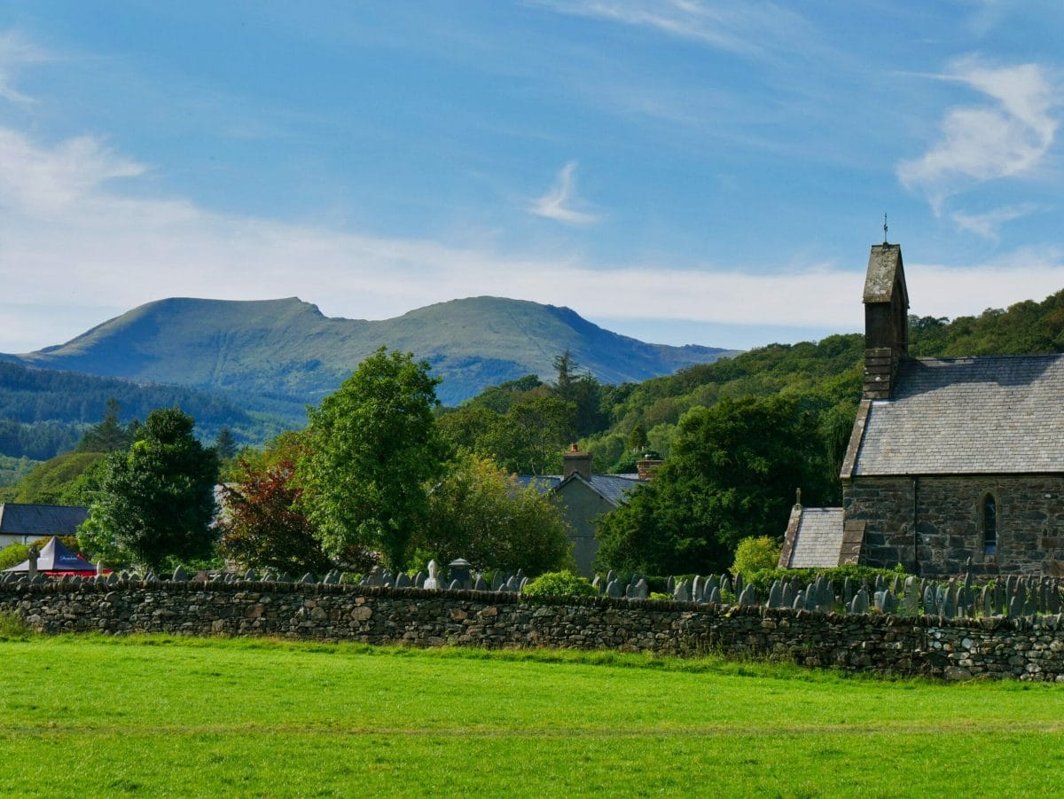 A church in Wales with hills in the background