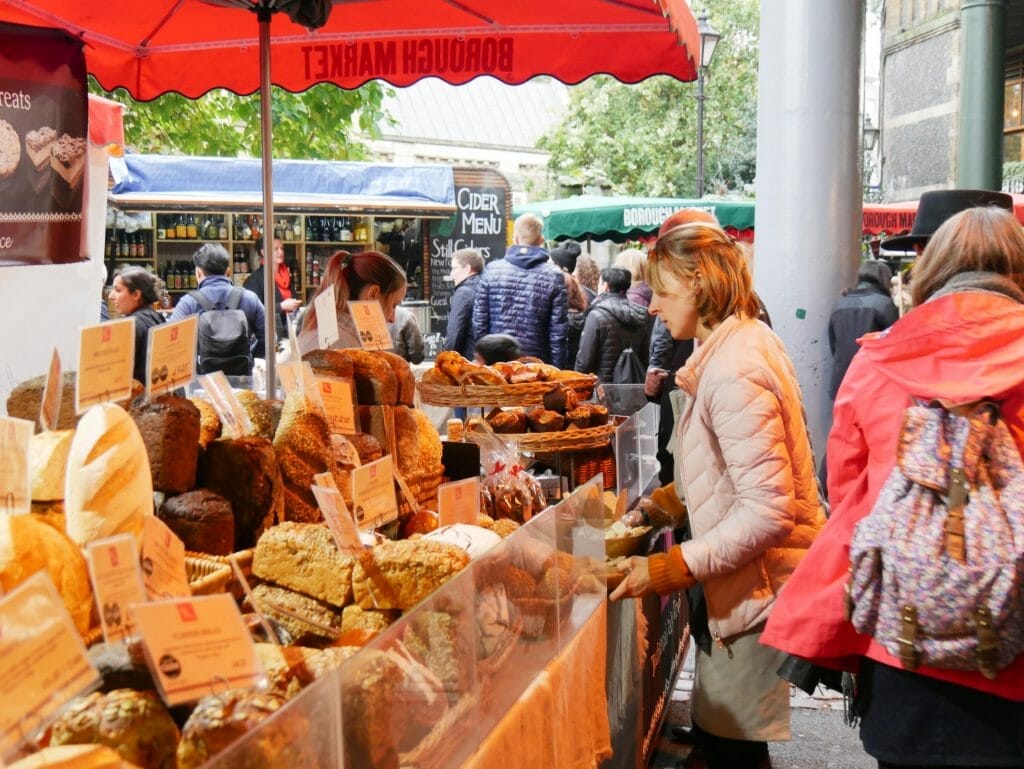 A bread shop at Borough Market London with a lady being served