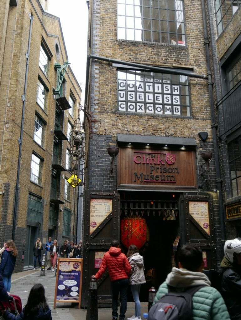 The Clink Prison Museum London Bridge Exterior with a hanging skeleton in a cage