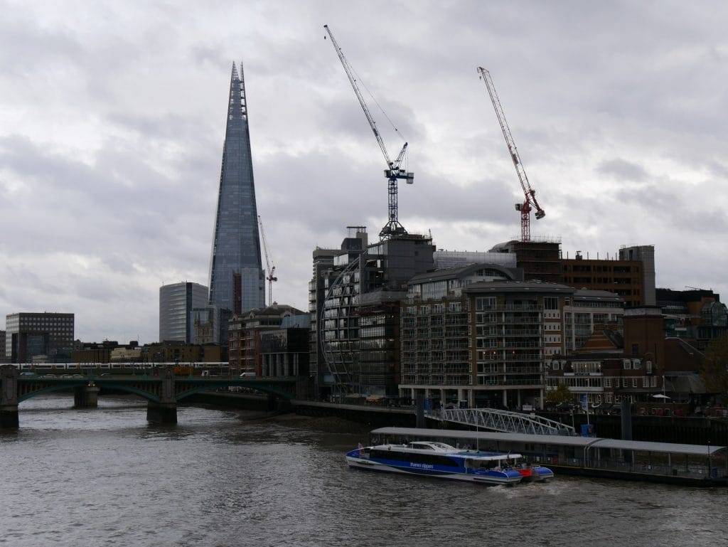 A boat tour on the River Thames with The Shard in the background at London Bridge