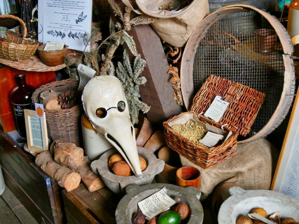 A Plague Doctor mask on a table of herbs at The Old Operating Theatre in London Bridge