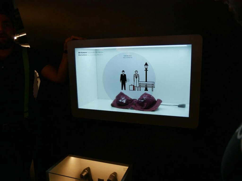 A video display with a bra with a built-in camera behind it