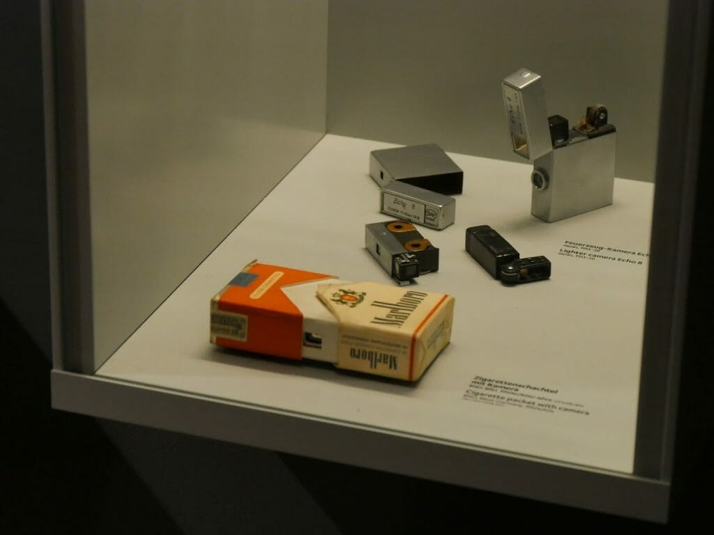 A display case with a camera disguised as a cigarette packet