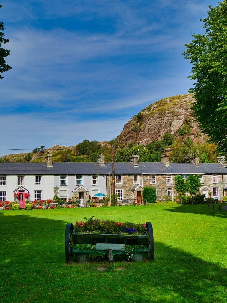 A row of houses in Beddgelert, Wales, with flowers in front