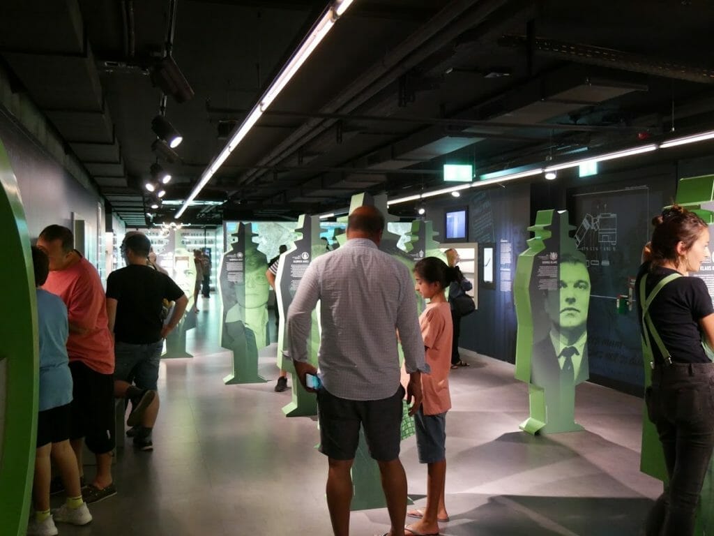 Inside the German Spy Museum, Berlin, with people looking at displays