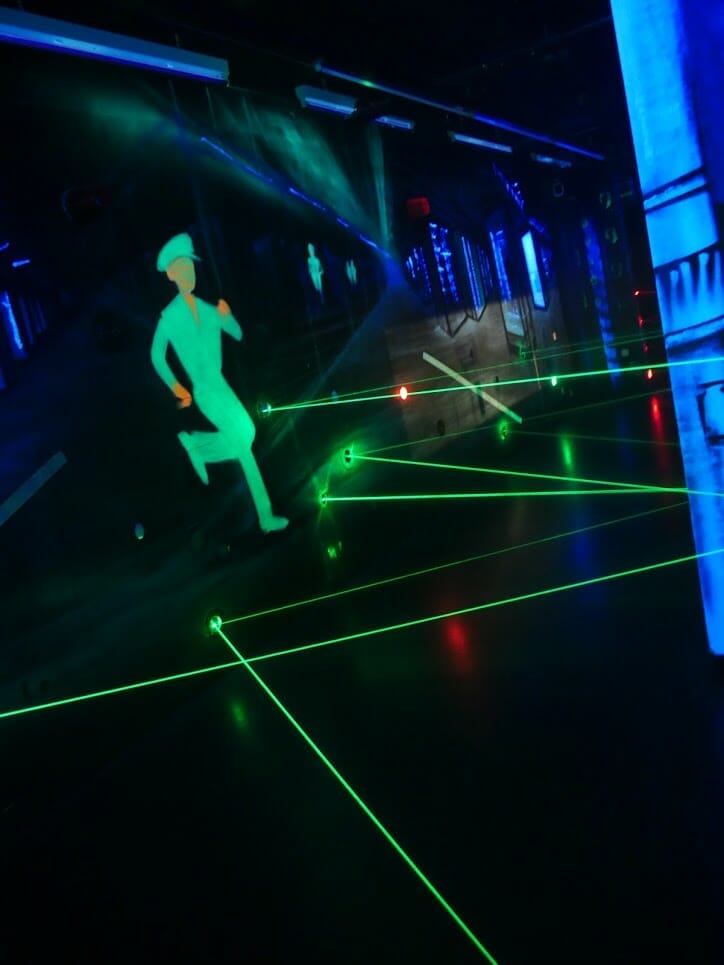 Green lasers going across a room in the laster game in the German Spy Museum, Berlin