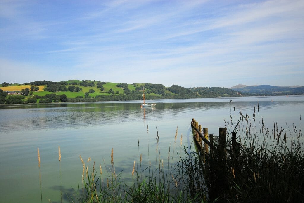 A boat on a calm Lake Bala in Wales