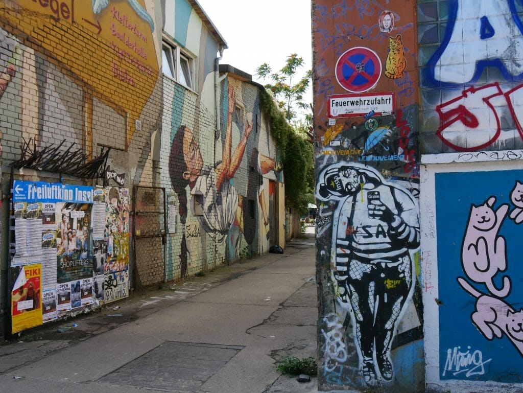 Street art down an alleywal on the Secret Food Tour Berlin