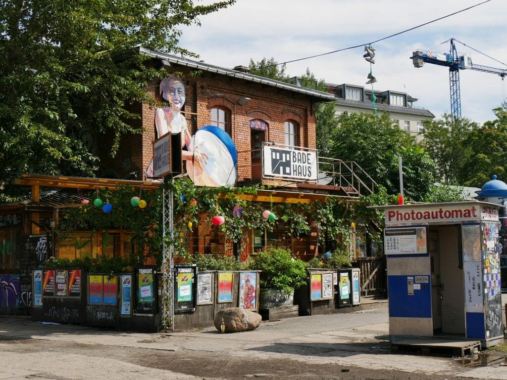 A bar surrounded by posters and greenery on the Berlin secret food tour