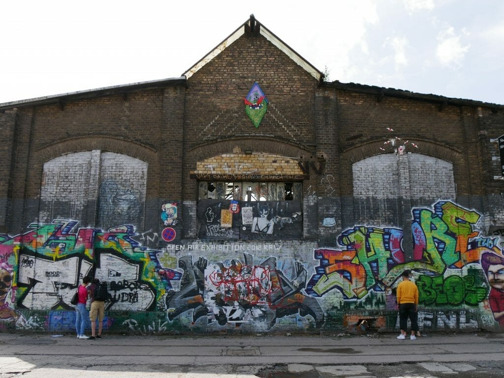 People looking at street art on the Berlin food tour