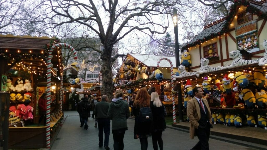Hyde Park Winter Wonderland stalls with soft toys and people walking around