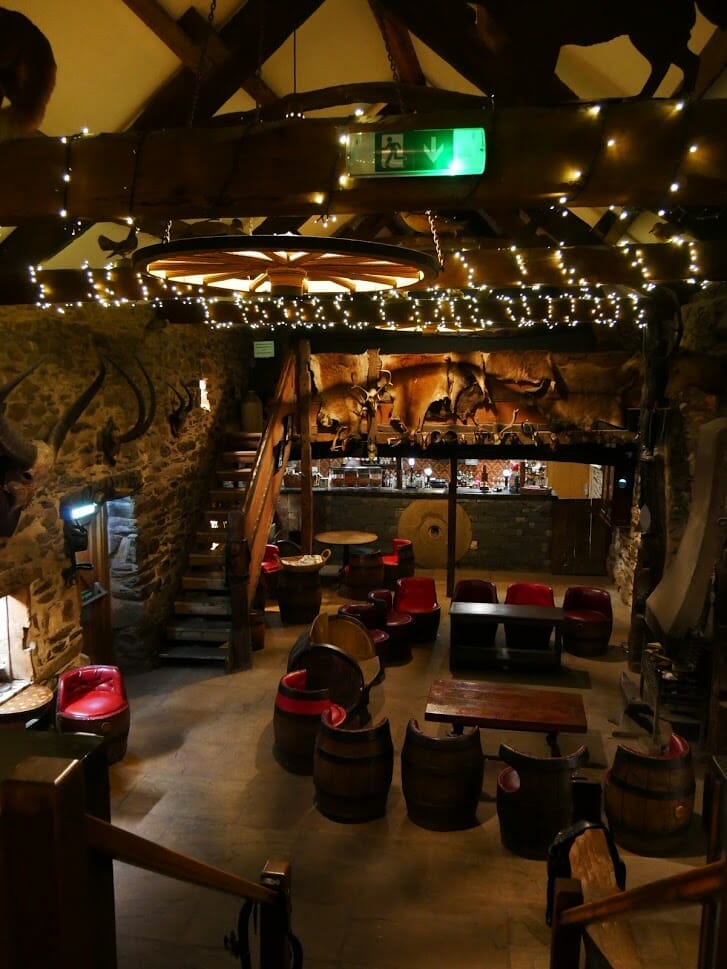 Inside the bar at The Quiet Site Lake District, with lots of rustic and agricultural decor