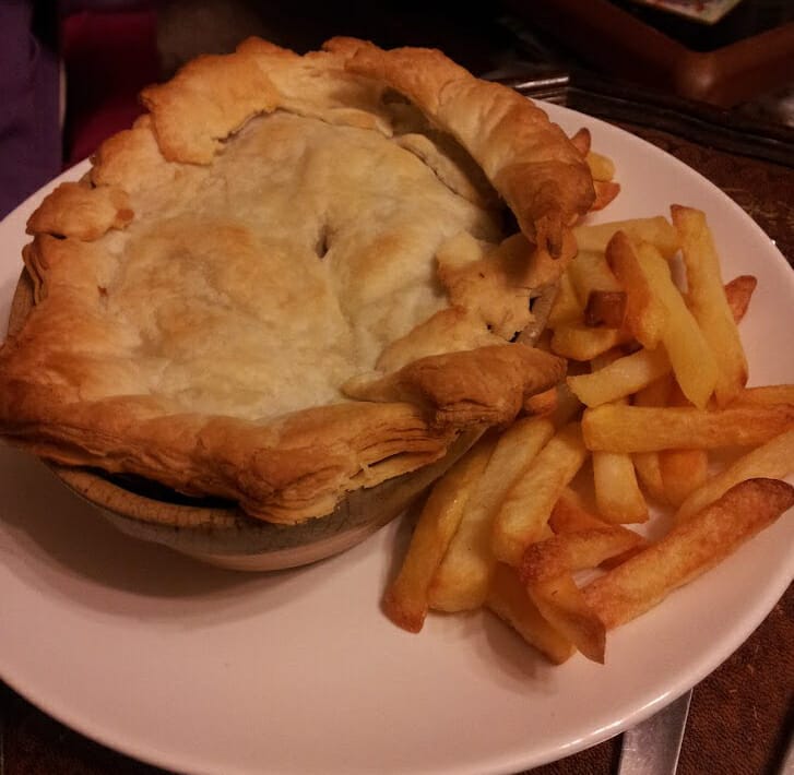 Pie and chips on a plate