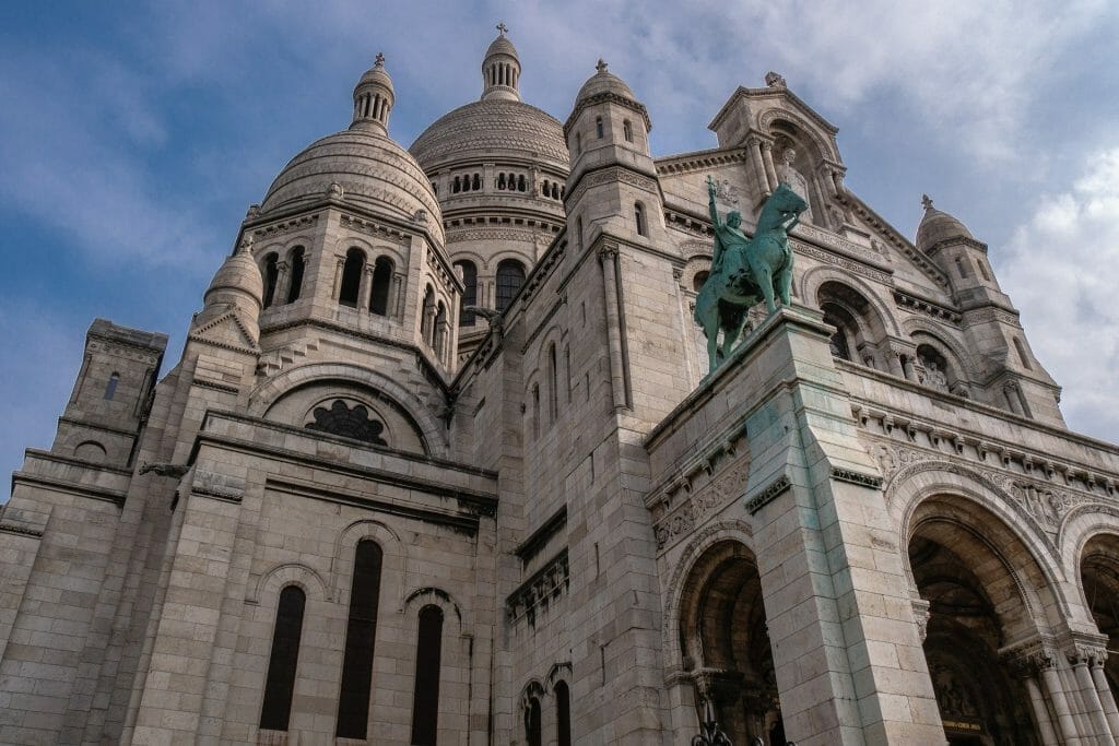 The Sacre Coeur in Paris seen from below with blue sky