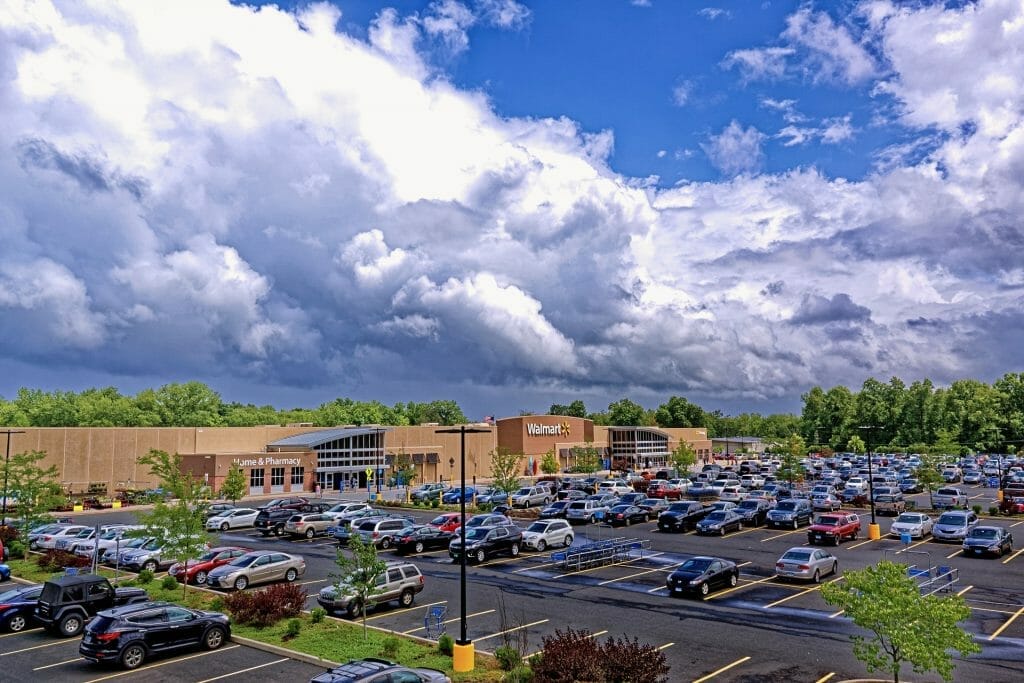 A large Walmart store with cars parked outside