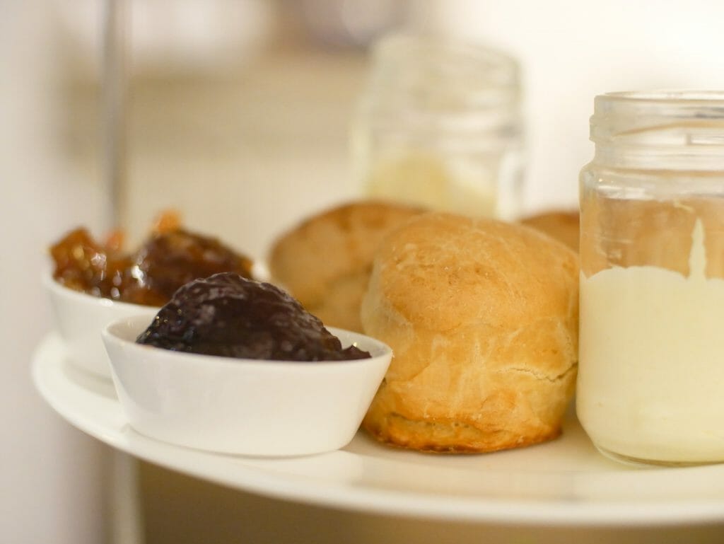 Scones clotted cream and jam on a plate