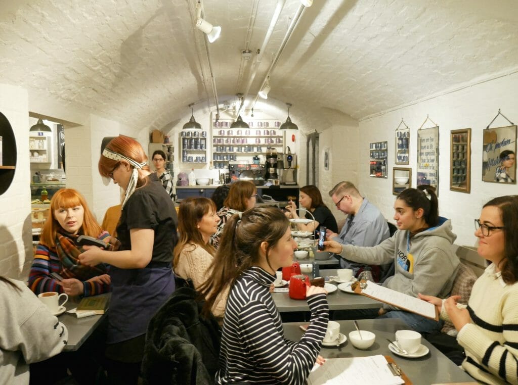 Inside Whittard Covent Garden afternoon tea room with people eating and talking