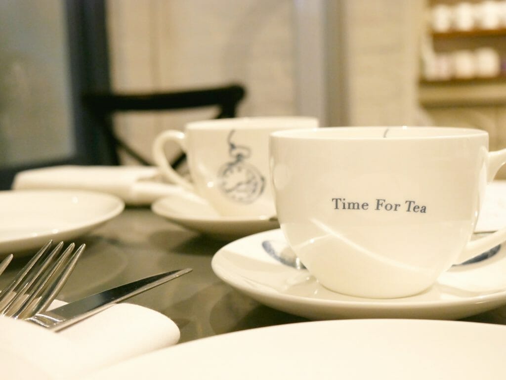 A cup that says "time for tea" on it