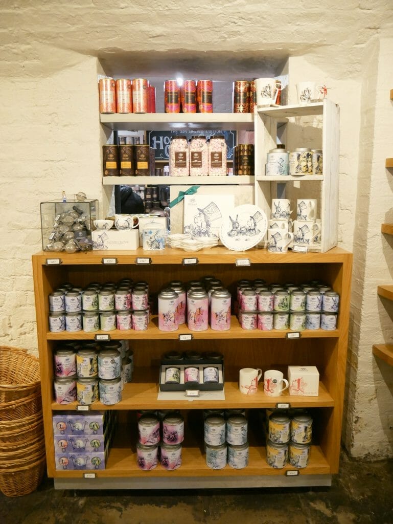 A bookshelf with tea items on for sale