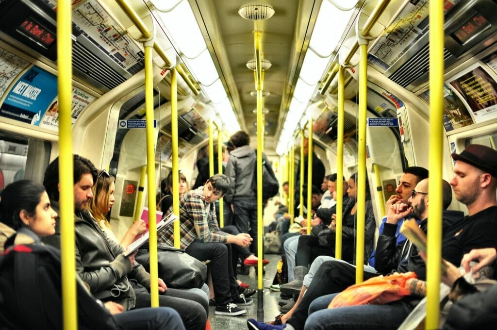people sitting on tube