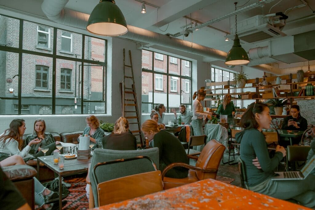 people talking in a cafe