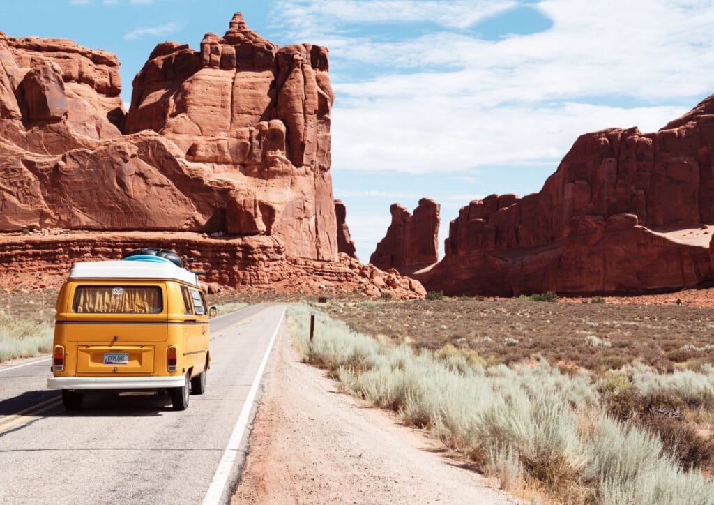 yellow RV on desert road