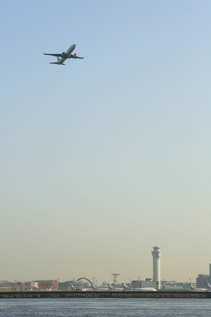 airplane taking off over airport